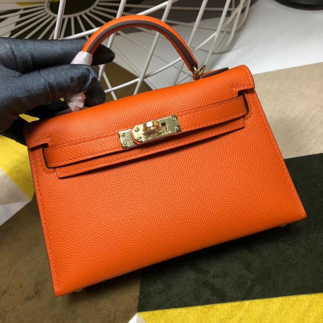 A LIMITED EDITION ORANGE H & GOLD CHÈVRE LEATHER MINI KELLY 20 II